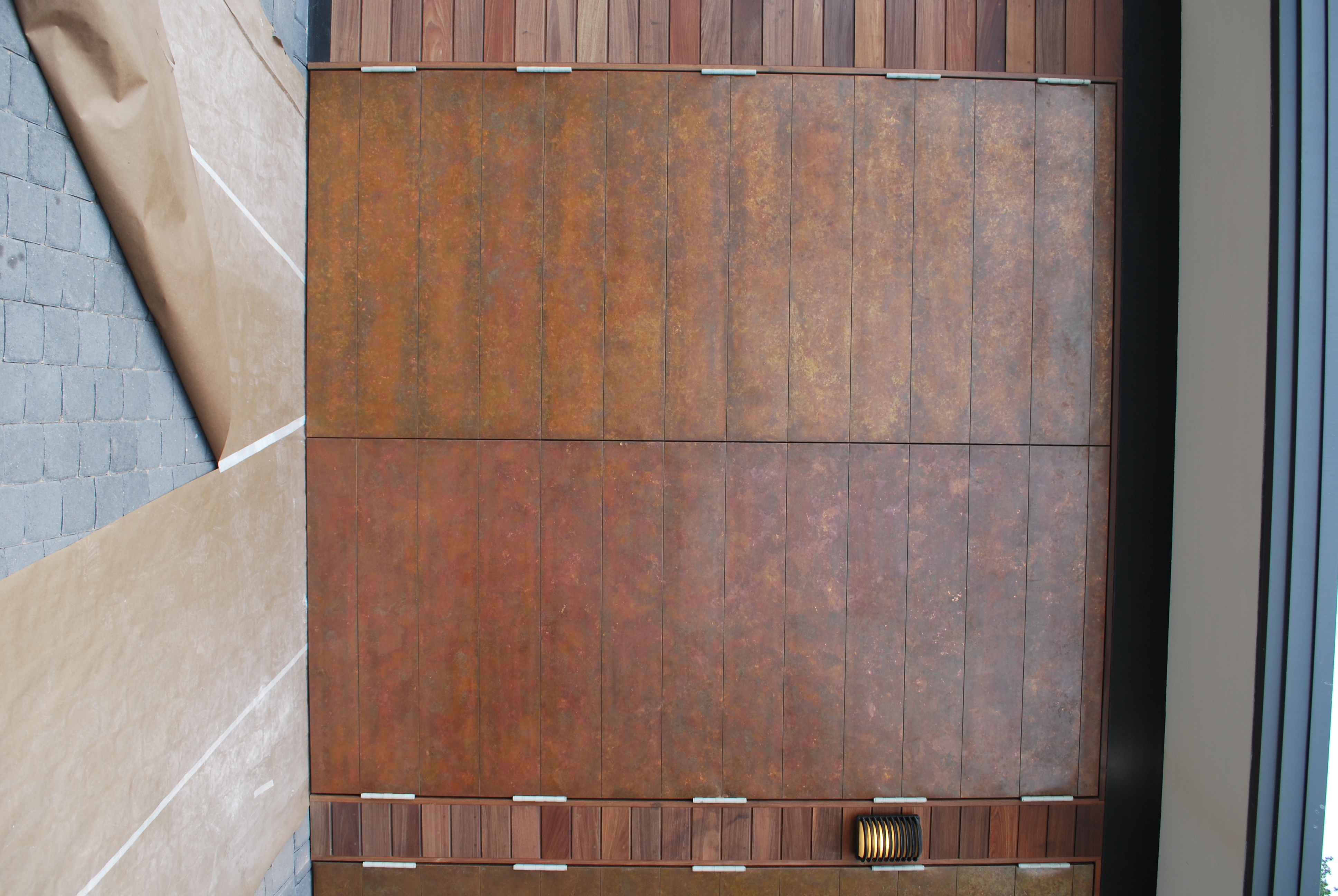 -copper-clad-swing-doors-with-individual-panels-to-match-siding-3
