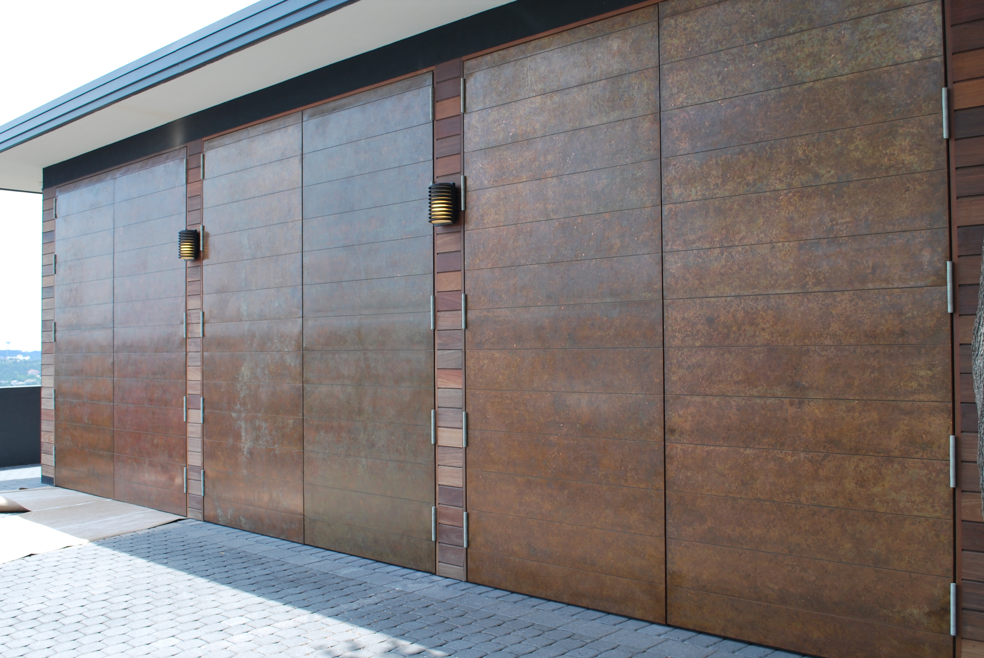 DD-copper-clad-swing-doors-with-individual-panels-to-match-siding